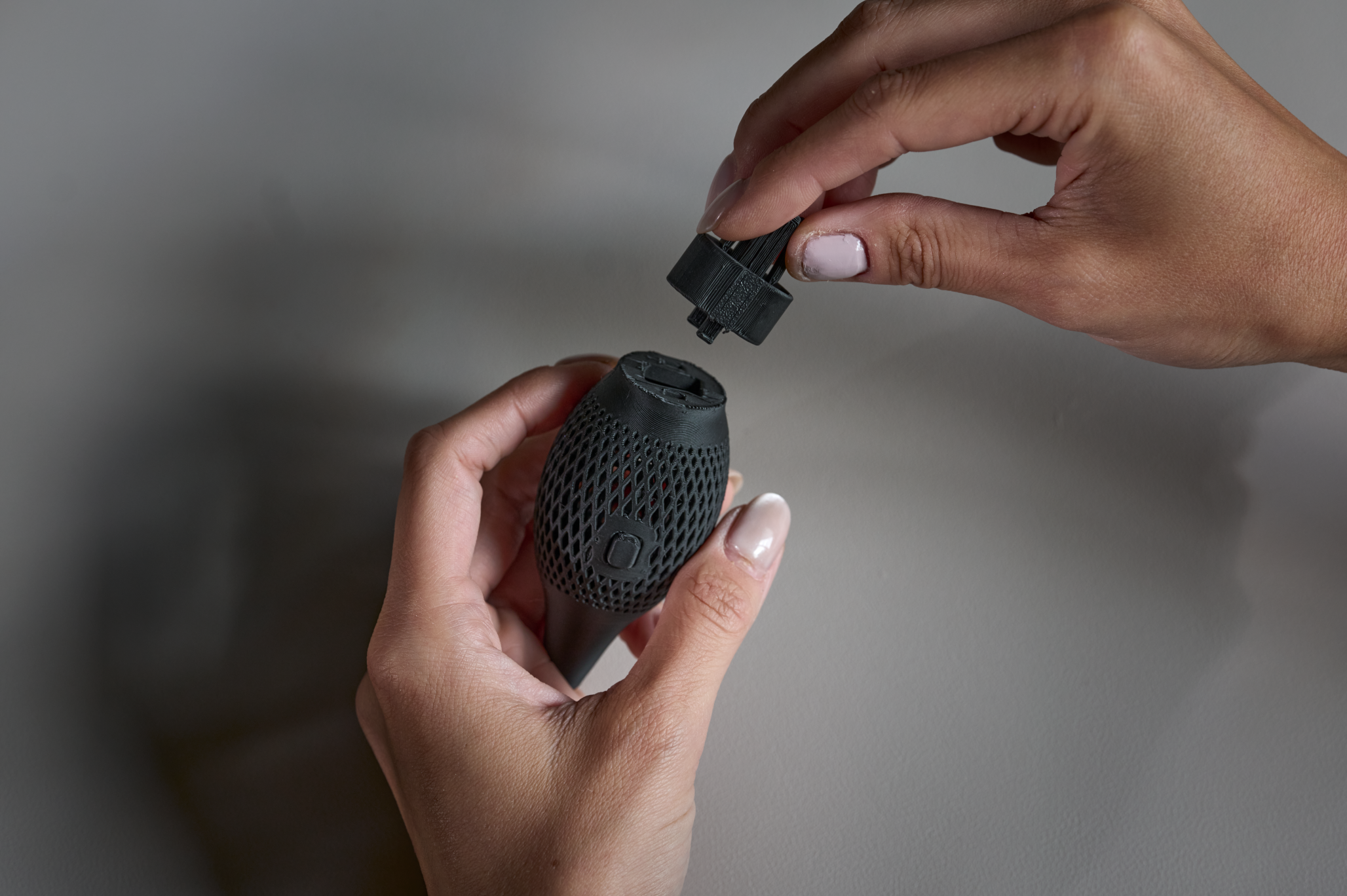 A cap is placed on top of part 3, the topper, of the Surface Slim Pen grip.